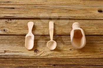 Set of three scoops on wooden background