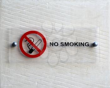 No smoking notice on white wall
