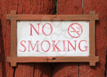 No smoking notice on  wood