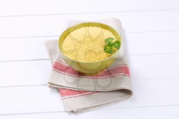 bowl of raw couscous on place mat