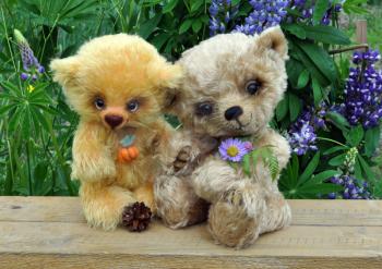 Handmade, the sewed toys: two friends teddy-bears among flowers