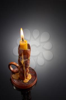 candlestick with candle on black background