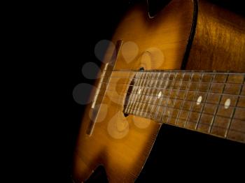 classical guitar isolated on black background