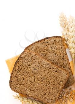 rye bread and ears of wheat isolated on white background