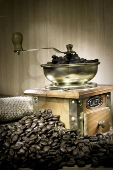 beans and grinder on sacking in sepia