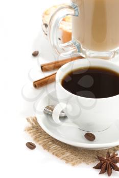 cup of coffee with beans and sweets isolated on white background