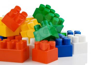 colorful plastic toys bricks isolated on white background