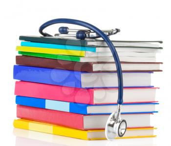 stethoscope and pile of books isolated on white background
