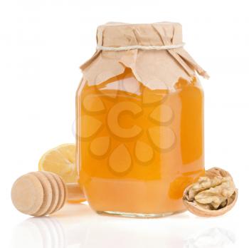 jar of honey and lemon isolated on white background