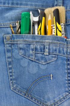 tools in blue jeans pocket
