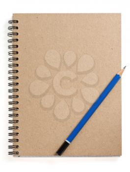 pencil on checked notebook isolated at white background