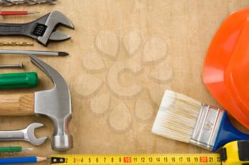 set of tools on wood background texture
