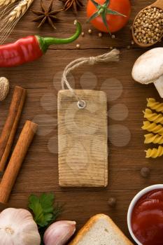 tag price and food ingredients on wooden table