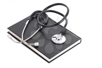 black book and stethoscope on white
