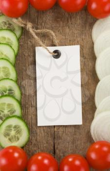 healthy vegetable food and price tag on wood background texture