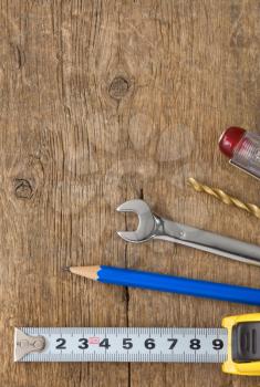 kit of tools on wood background texture