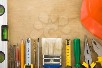 set of tools and instruments on wood texture background
