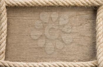 ship rope and copy space wooden background