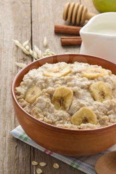 bowl of oatmeal on wood background