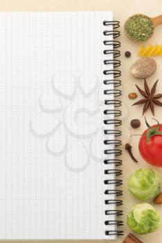 food ingredients and recipe book on aged background