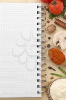 food ingredients and recipe book on aged background