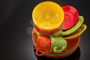 set of dishware on black background