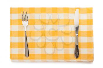 knife and fork at napkin on white background
