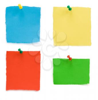 pushpin and ragged note paper isolated on white background
