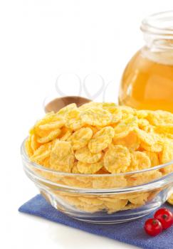 corn flakes in bowl isolated on white background