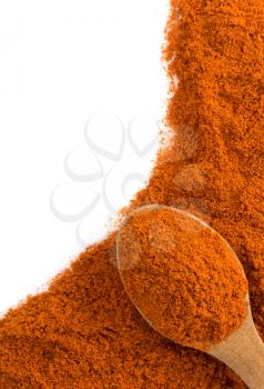 paprika powder and spoon isolated on white background