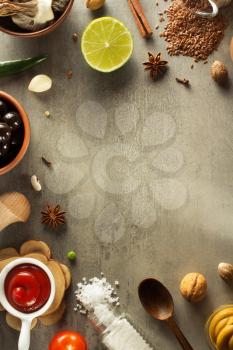 herbs and spices at stone table background