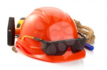construction helmet and tools isolated on white background