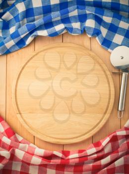 napkin and cutting board on wooden background