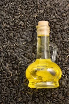 bottle of oil and  sunflower seed