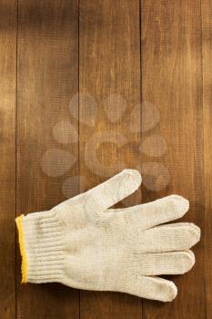 work  gloves on wooden background