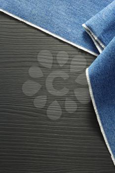 blue jeans texture on wooden background