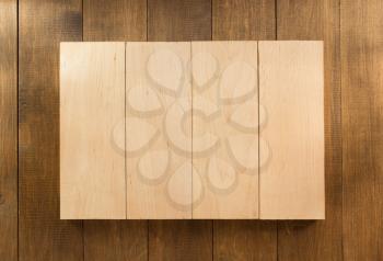board panel on wooden background