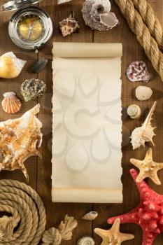 old paper and seashell on wooden background texture