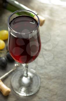 wine glass and grapes on table