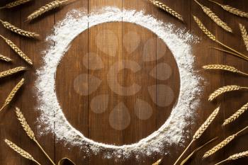 flour powder on wooden background