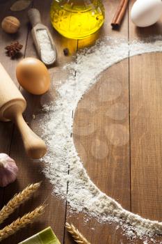 flour powder on wooden background