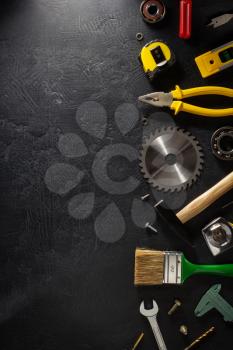 set of tools and instruments on black background