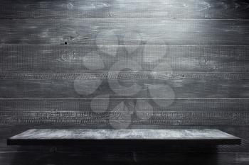 wooden shelf at black  background texture