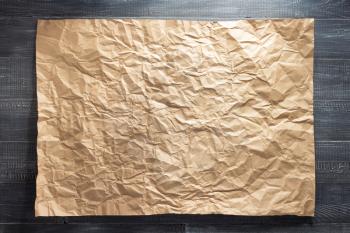 sheet of paper at wooden background texture