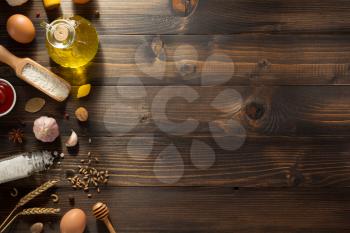 bakery ingredients on wooden background