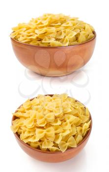 farfalle pasta in bowl isolated on white background