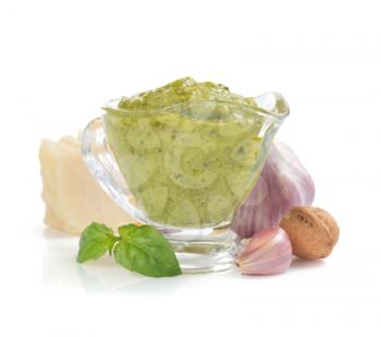pesto sauce in gravy boat isolated on white background