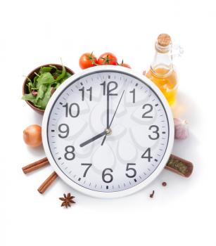 wall clock and food herbs and spices isolated on white background