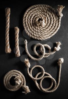 ship rope at old black background, top view