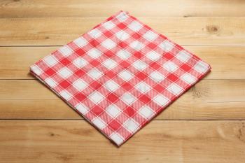 cloth napkin on at rustic wooden plank board table background